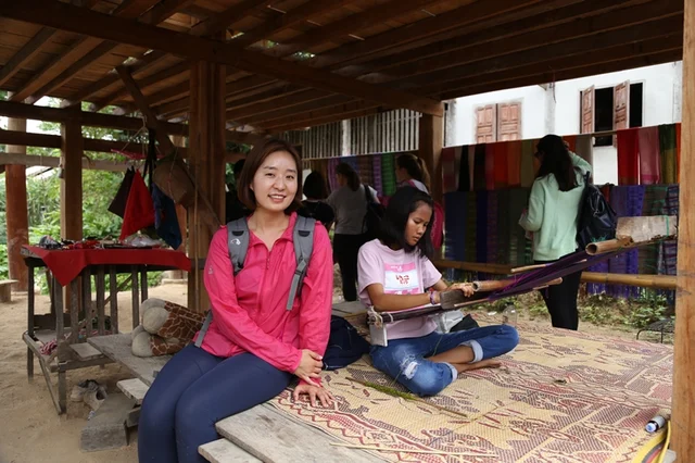 Weaving traditional hill tribe fabric with villagers