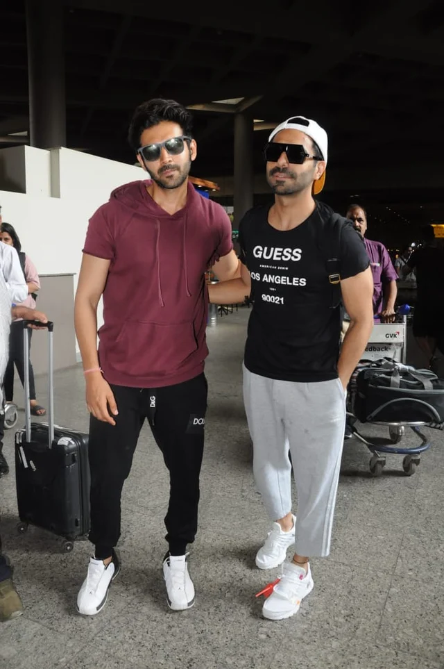 Kartik Aaryan and Aparshakti Khurana spotted at the airport. Photo by Viral Bhayani