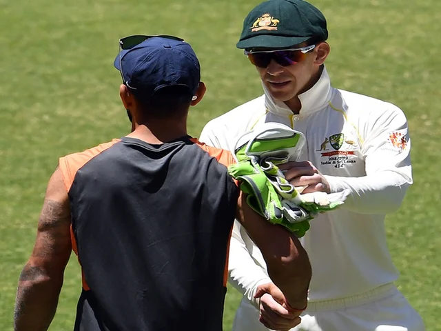Australia’s captain Tim Paine (R) shakes hand with Indian captain Virat Kohli after winning the second Test cricket match between Australia and India in Perth. Photo by WILLIAM WEST / AFP
