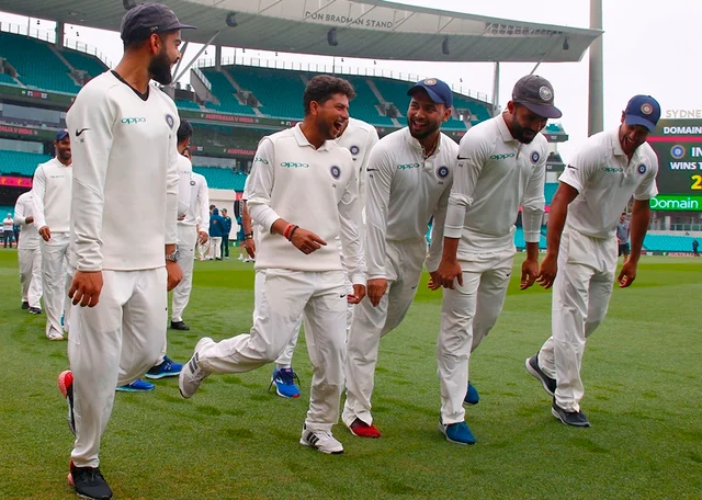 Virat Kohli (L) dances with teammates as they celebrate winning the Test series between India and Australia at the Sydney Cricket Ground. Photo by DAVID GRAY / AFP