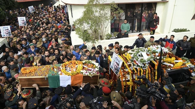 Army personnel and people pay their last respects to the mortal remains of Major Vibhuti Shankar Dhoundiyal, who lost his life in Pulwama encounter with Jaish-e-Mohammed (JeM) terrorists, ahead of his funeral, in Dehradun, Tuesday, Feb 19, 2019. (PTI Photo)