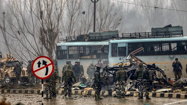 Security personnel carry out the rescue and relief works at the site of suicide bomb attack at Lathepora Awantipora in Pulwama.