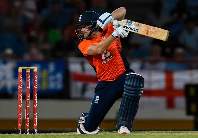 Jonny Bairstow hits a 4 during a T20 match between the West Indies and England. Photo by Randy Brooks / AFP
