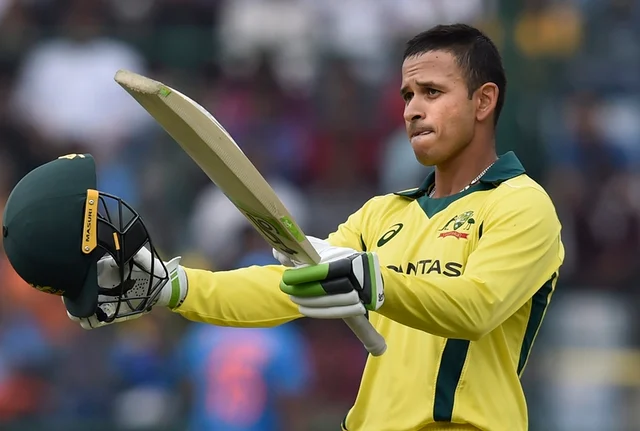 Australian batsman Usman Khawaja reacts after scoring his century during the 5th ODI cricket match against India, at Feroz Shah Kotla Cricket Stadium. PTI Photo/Ravi Choudhary