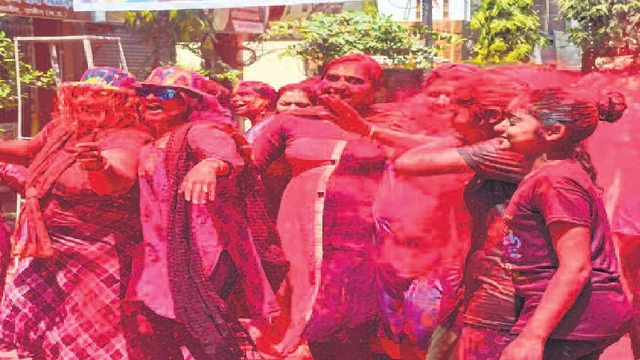 Women and girls enjoying the festival of colours at<br />Vikramaditya Cloth Market premises