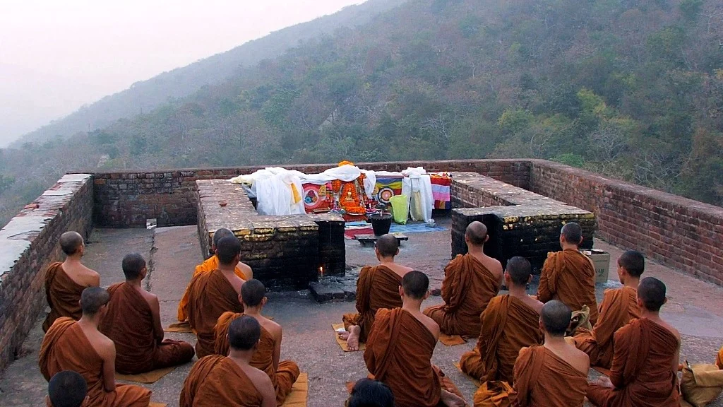 Buddhist monks meditating at Vulture’s Peak 