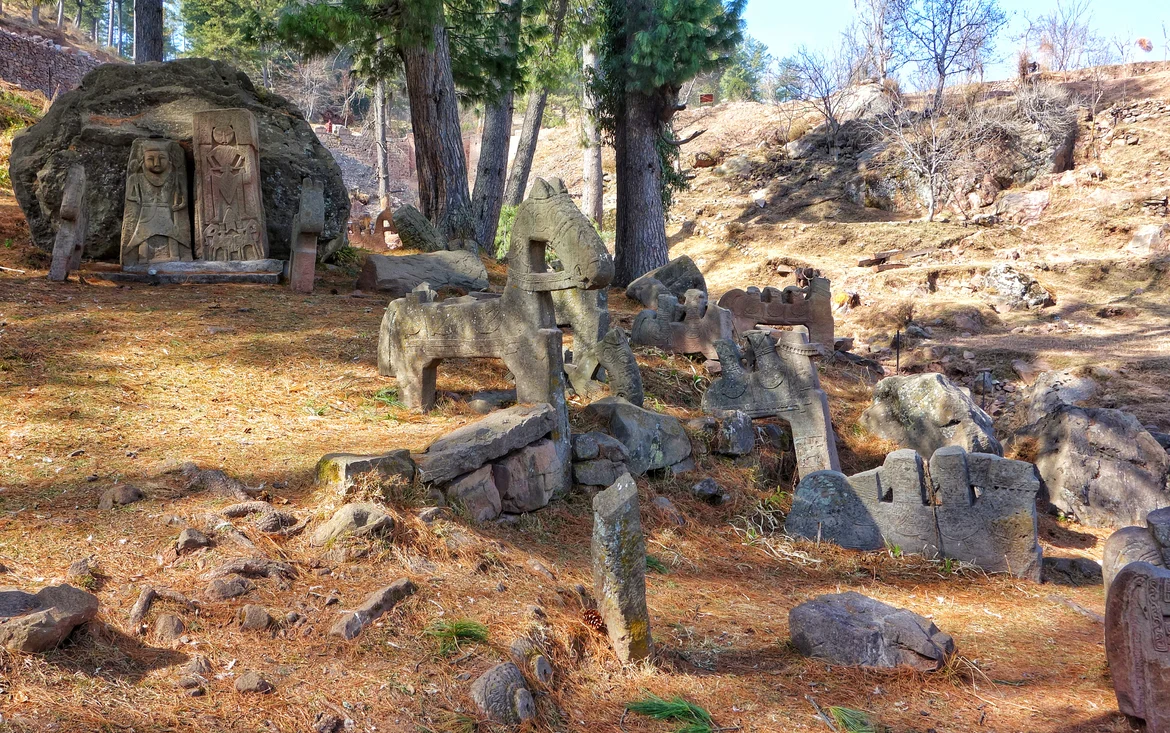 The Horsemen with reliefs of local gods in the background
