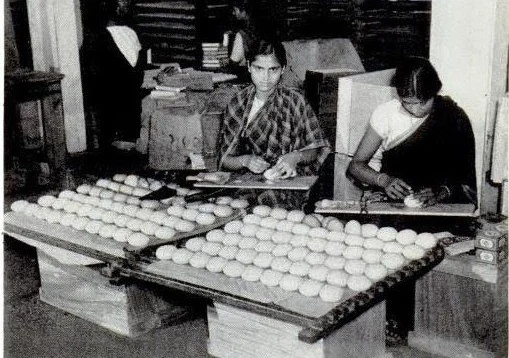 Cakes of Mysore soap are being wrapped at a factory in Bangalore