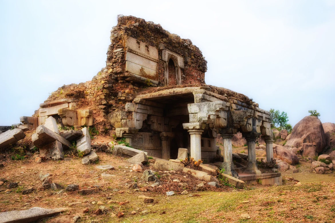 Ruined stone temple with inscription