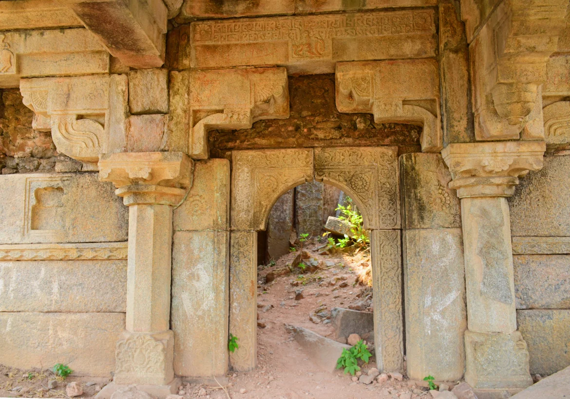 Doorway of the stone temple with inscription on its top