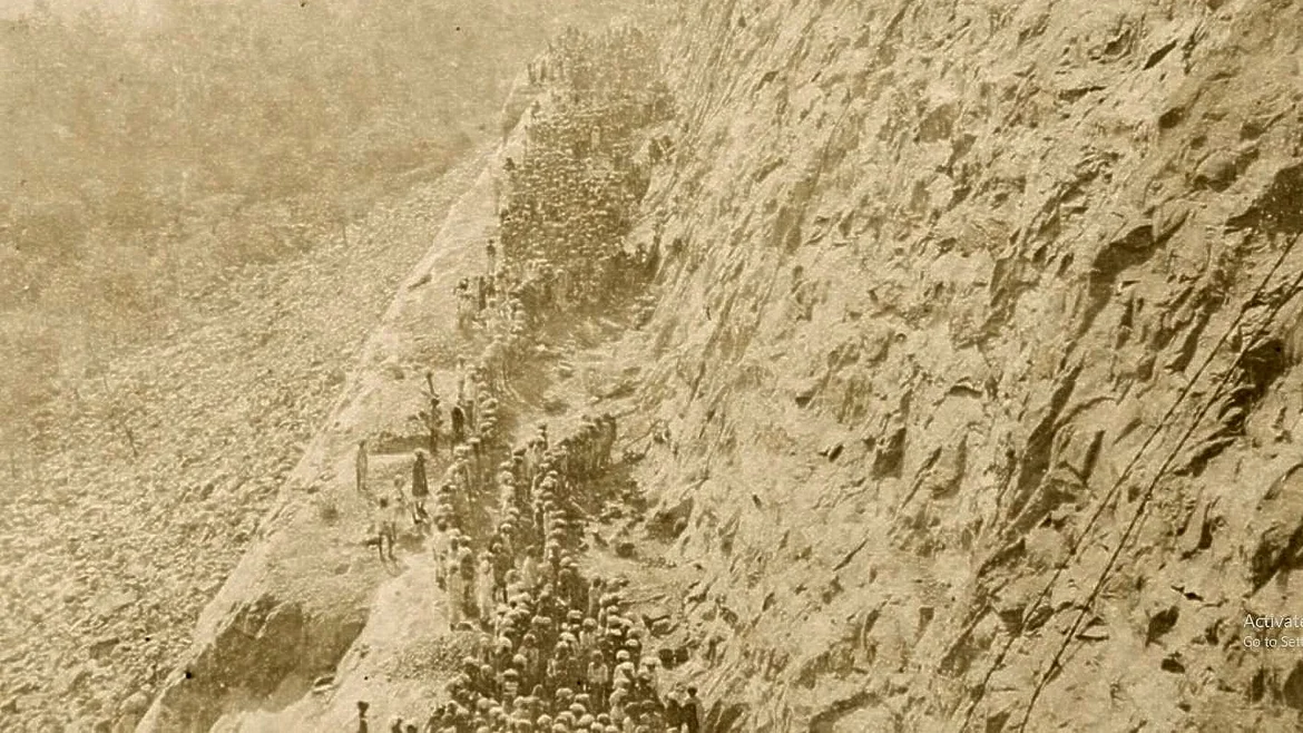 Men working on steep cliffs