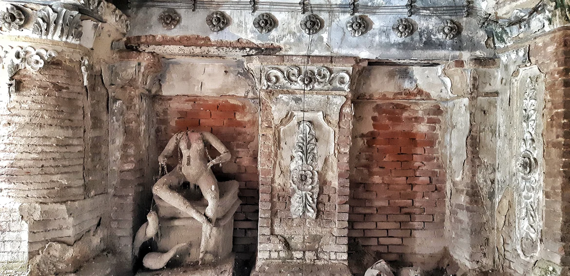 Remains of an intricately-carved sculpture at Basu Bati