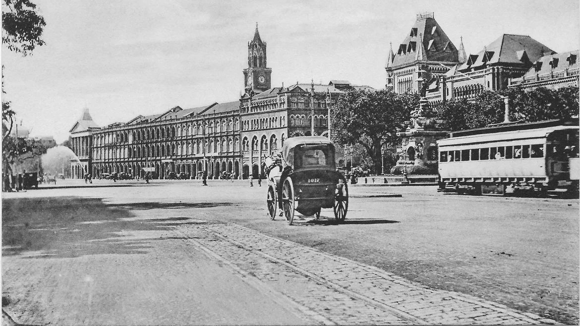 A tram with Flora Fountain in the background