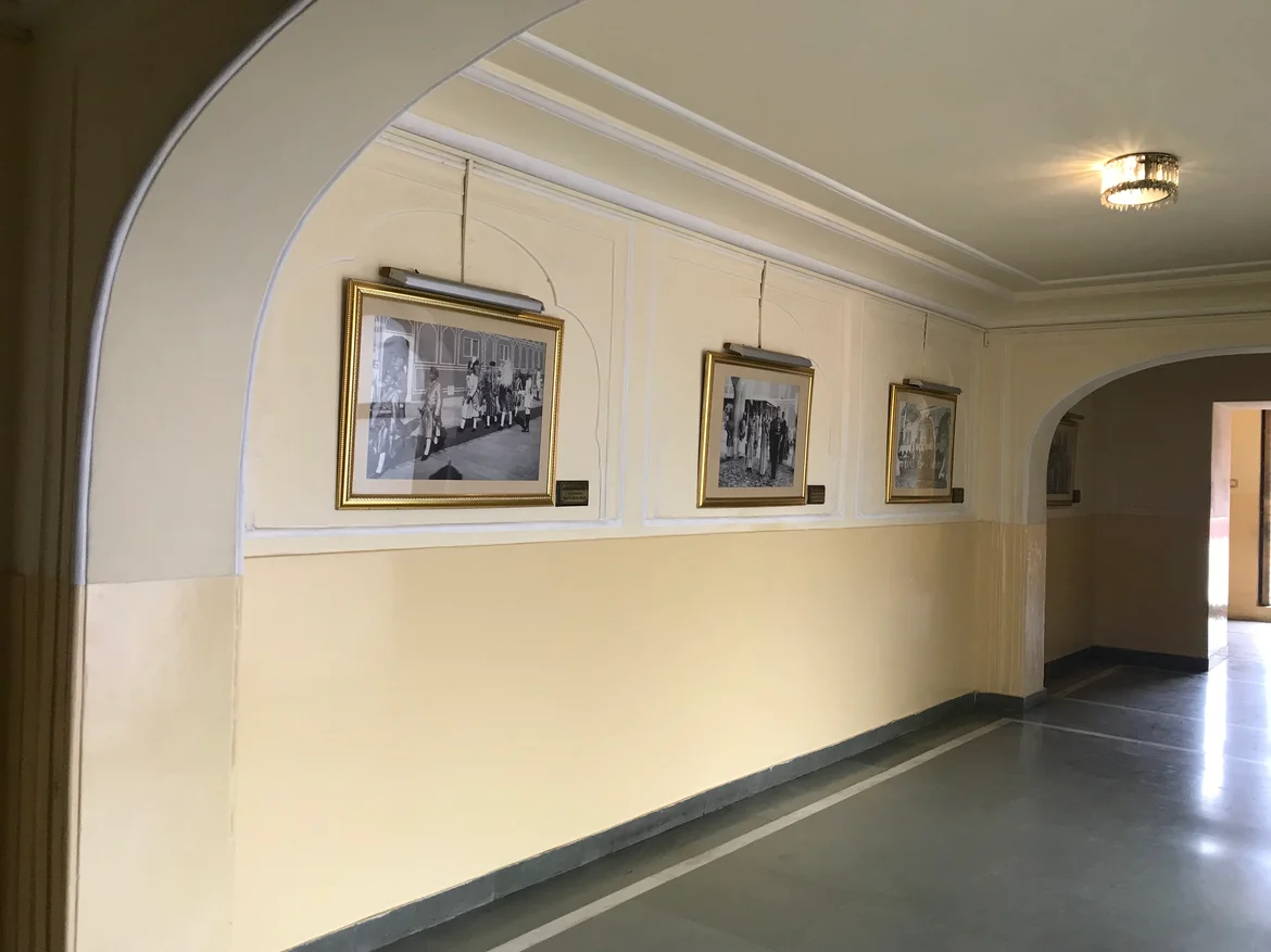Photographs of historical events at the Sabha Niwas in the corridor leading to the main hall.