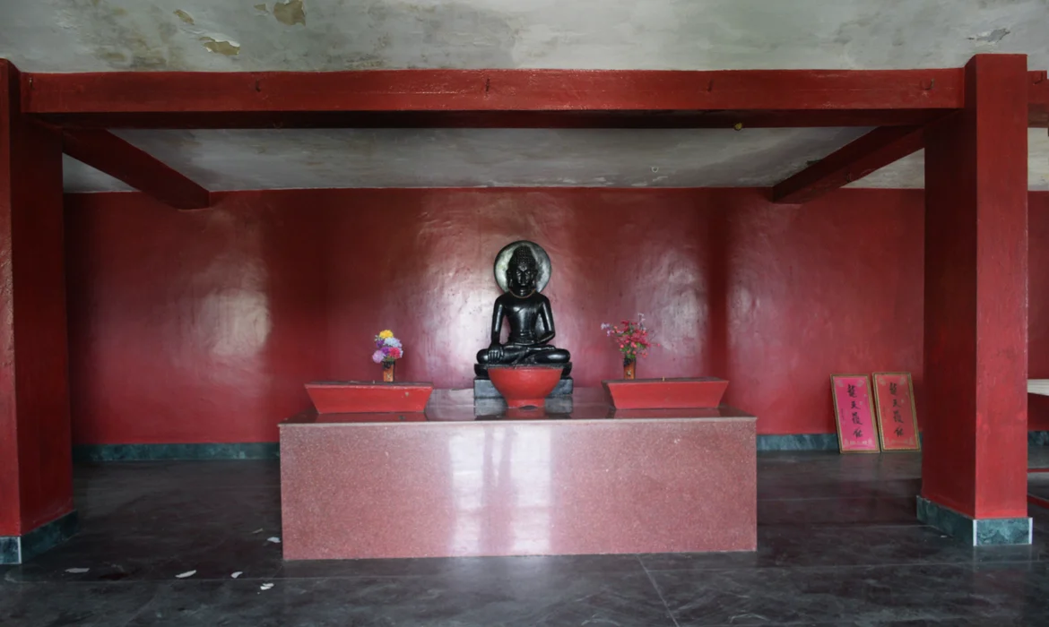 The statue of Buddha on the first floor of the temple
