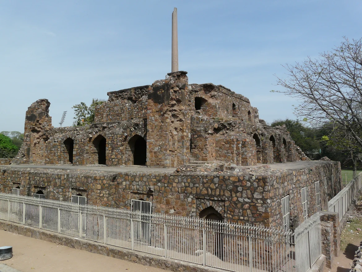 Ashokan Pillar atop palace ruins in Feroz Shah Kotla