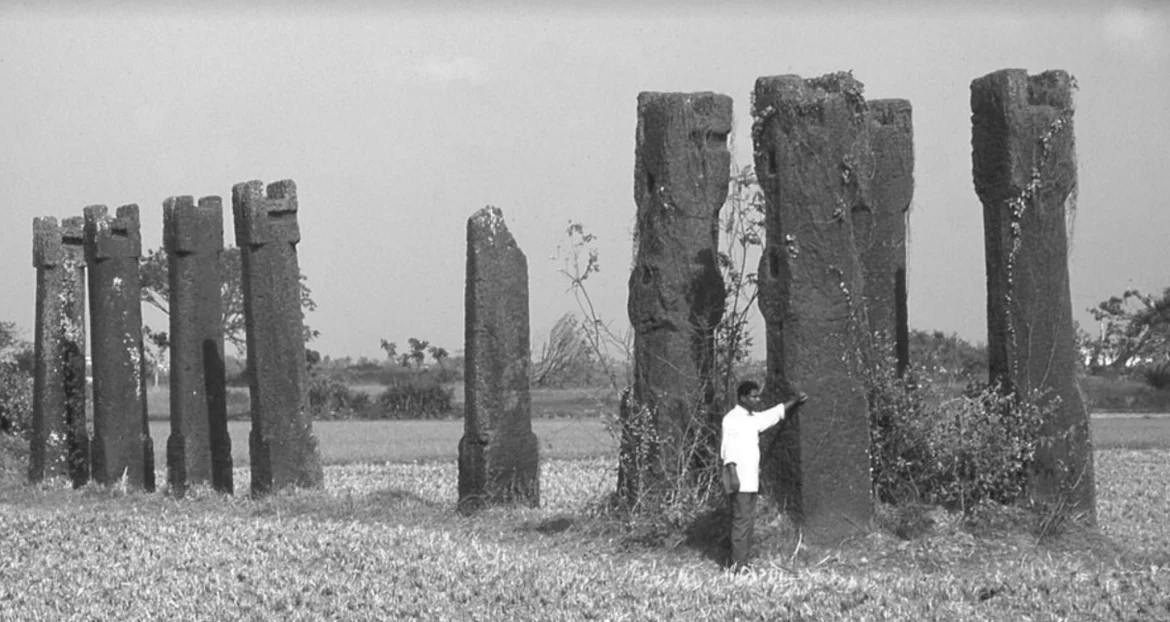 Monolithic pillars of laterite stone at centre of the site in Sisupalgarh