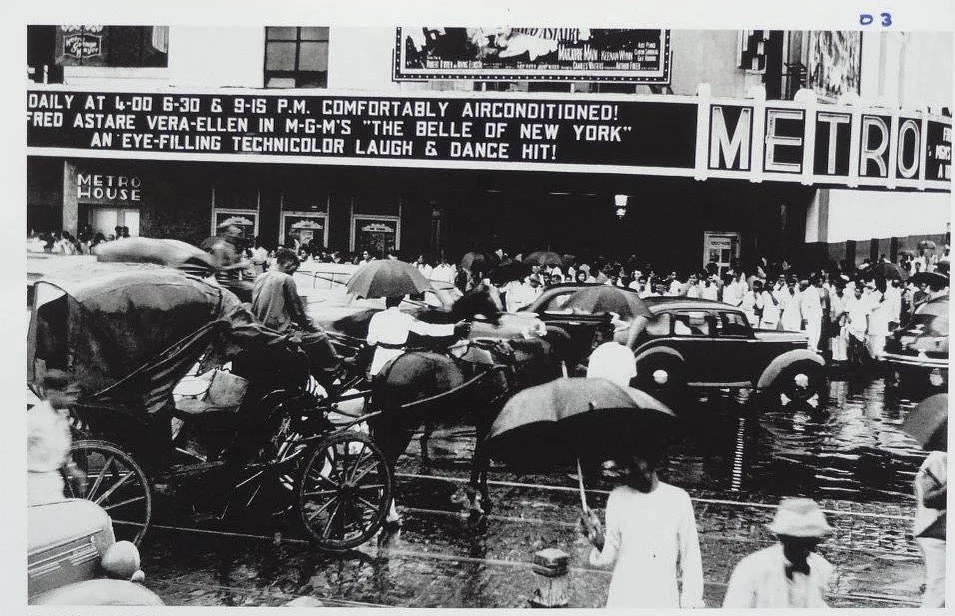 A busy road outside Metro Cinema, 1952
