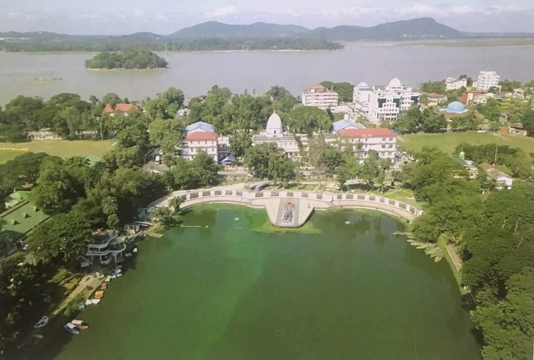 Ariel view of Digholi Pulhuri with the imposing Gauhati High Court building, and the River Brahmaputra flowing majestically