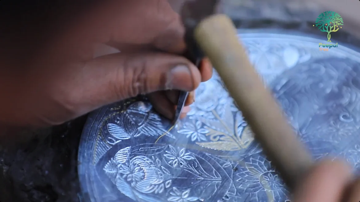 Engraving the design on the metal