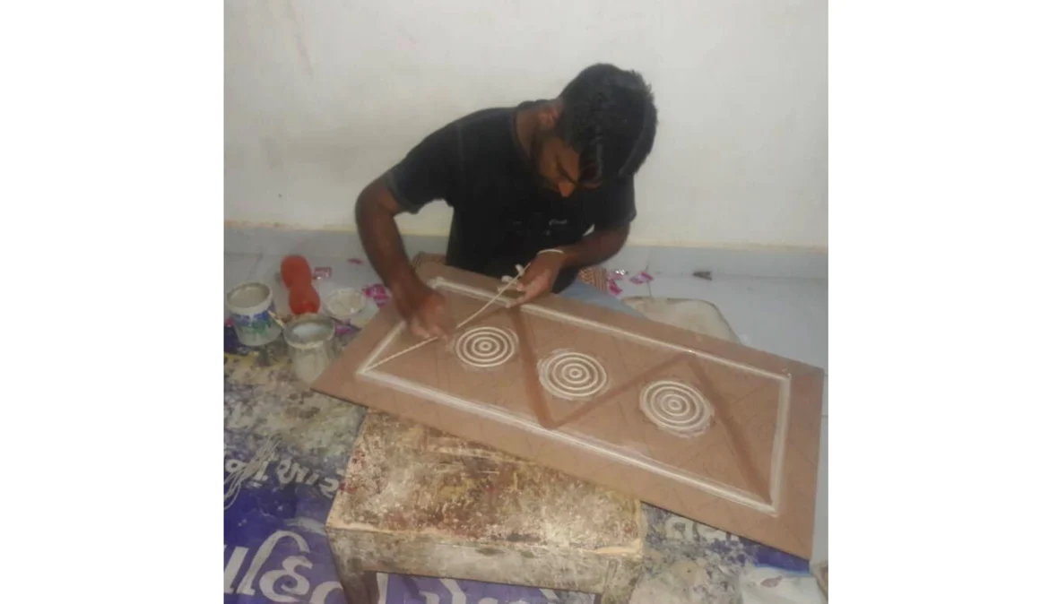 An artisan from Kutch working with the dough