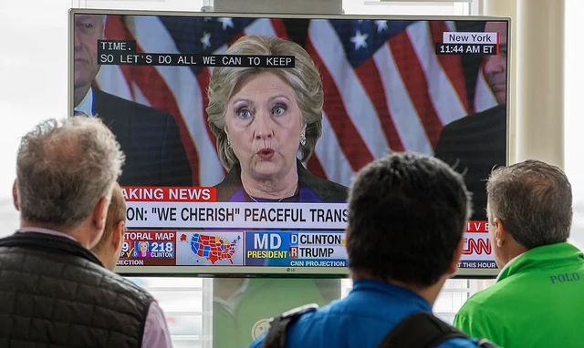 Hillary Clinton’s concession on a screen (PAUL J. RICHARDS/AFP/Getty Images)