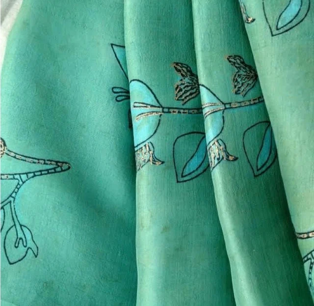 The fabric wears the green dye of Patang.