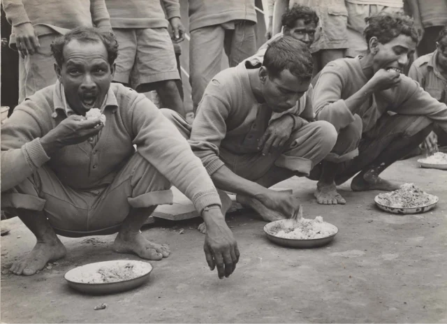Chabua, Assam, India, April 1944, Indian air freight workers eating rice.(Photo courtesy: Army Air Forces, Air Transport Command, Overseas Technical Unit, Washington DC)