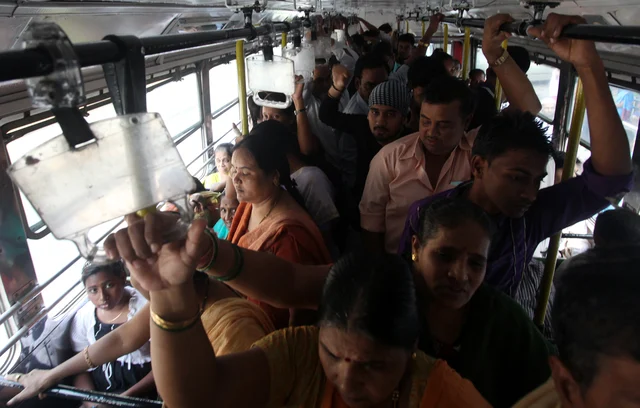 Women wade through a crowded bus (Anshuman Poyrekar/Hindustan Times via Getty Images)