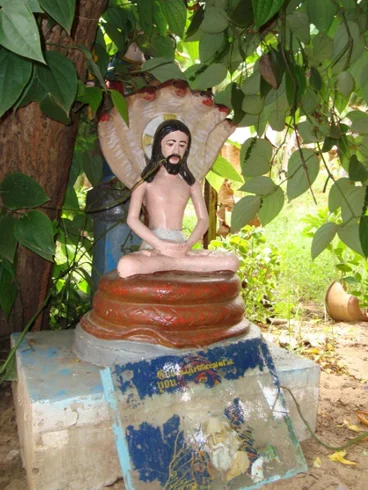 Jesus under the five-hooded serpent: the faded image of Griffiths on the slab at the bottom. 