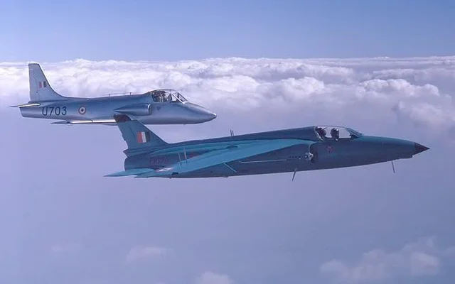 Gnat (dark blue) of the IAF in formation with HAL Kiran (silver) over the skies of Farnborough, United Kingdom, in the September of 1972 . 