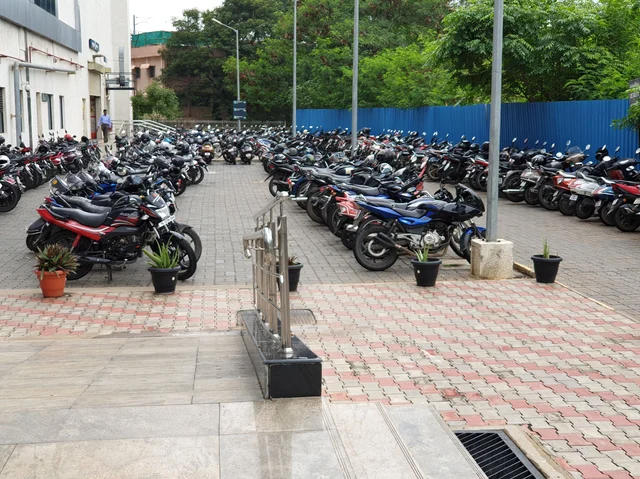 The two-wheeler parking lot is chock-a-bloc with vehicles of commuters who avail monthly passes.