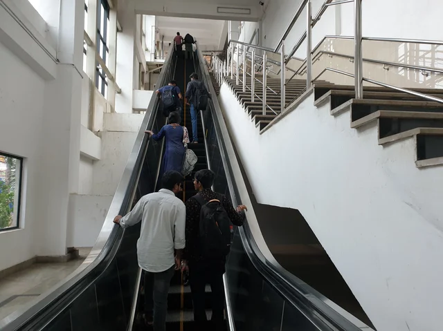 Commuters take the elevator at the Alandur metro station to reach the platforms to go to Chennai MGR Central and Washermanpet. 