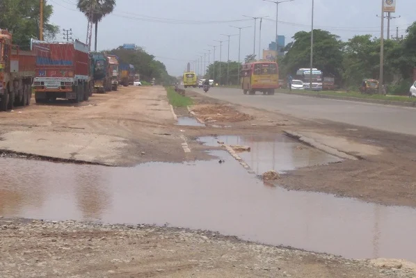 A National Highway in the district ravaged by rain. Note the absence of service roads here as well. 