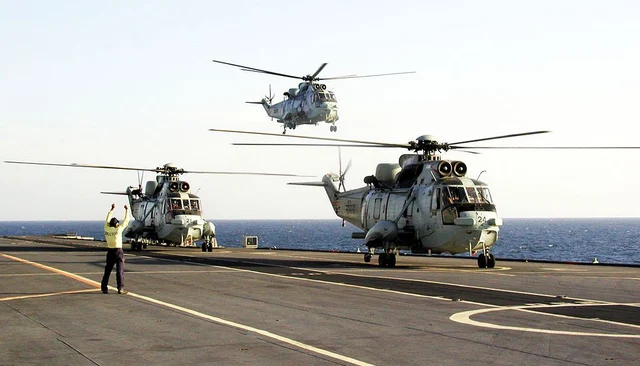 Indian Navy Sea King helos on an aircraft carrier. 