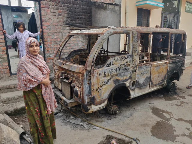Asmana Jabeen shows her husband’s burnt vehicle. 