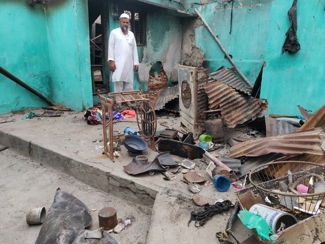 Mohammad Akhtar at his house that is completely gutted by fire. 