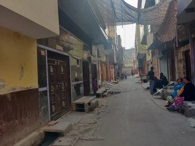 Outside the house of Vinod Kumar (where women are sitting)