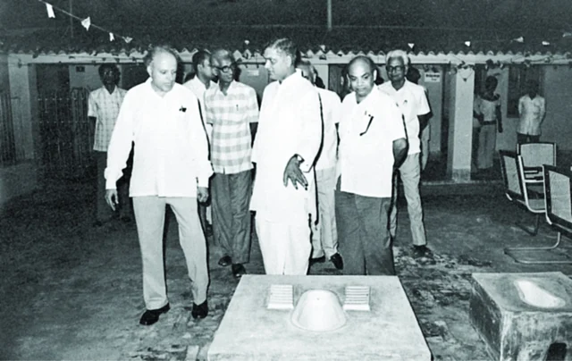 A demonstration of two-pit pour flush toilet developed by Pathak. 