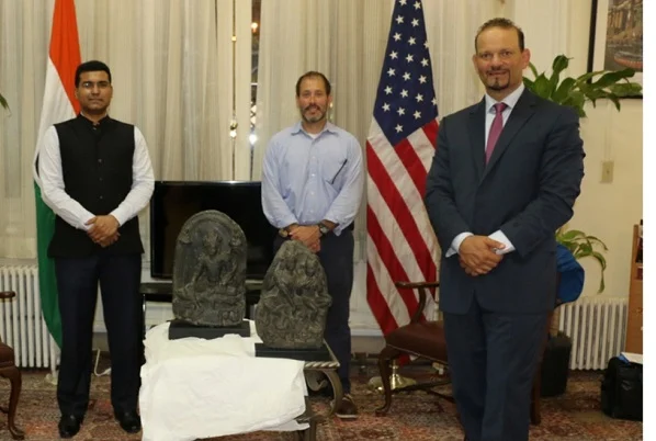 Officials of the US and Indian establishments, with the idols.