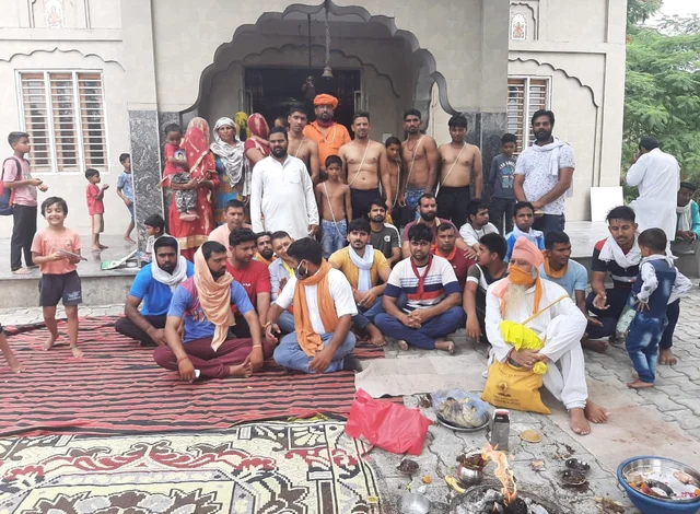 A picture after the ‘ghar wapsi’ event in Aasan Kalan. The shirtless men in Janeu are the new converts