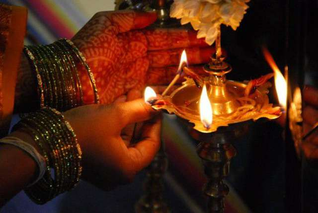 dispelling darkness during diwali the subtleties of lighting a lamp