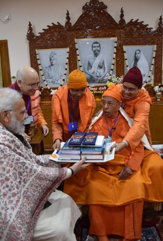 Monks of the order gifting the PM some books. 