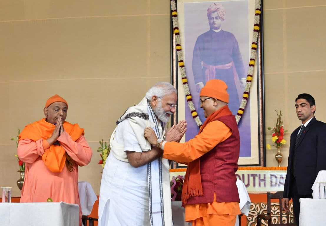 PM Modi being greeted before a speech. 