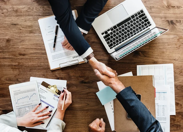 Be sure, before you sign any contract. alt. Image of the people on a meeting.