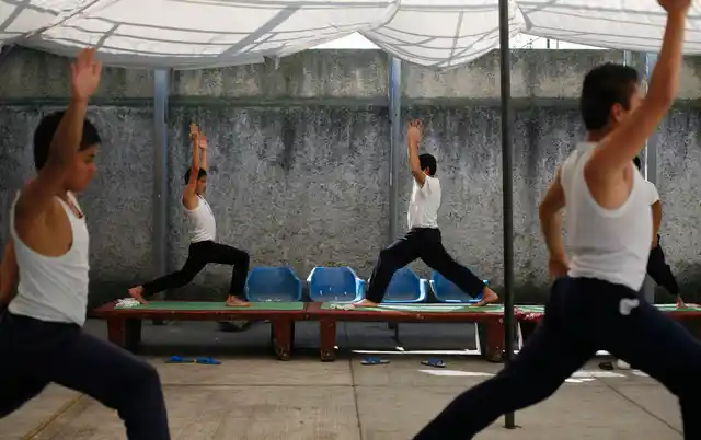 Inmates practice yoga during class inside a juvenile detention centre in Mexico City. (Photo: Reuters)