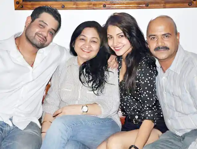 Anushka with her parents and brother