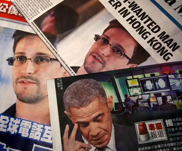 Photos of Edward Snowden, a contractor at the National Security Agency (NSA), and US President Barack Obama are printed on the front pages of local English and Chinese newspapers in Hong Kong. (Photo: Reuters)