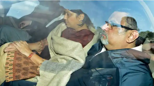 File picture of Aarushi’s parents Rajesh Talwar (R) and Nupur being taken to a court in 2013.
