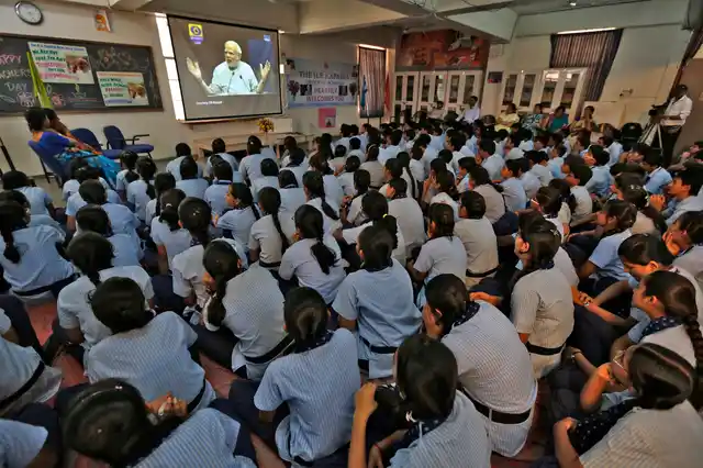 Students watch Indian Prime Minister Narendra Modi on screen as he speaks during a nationwide address to school children during Teachers’ Day in the western Indian city of Ahmedabad September 5, 2014. (Photo: Reuters)